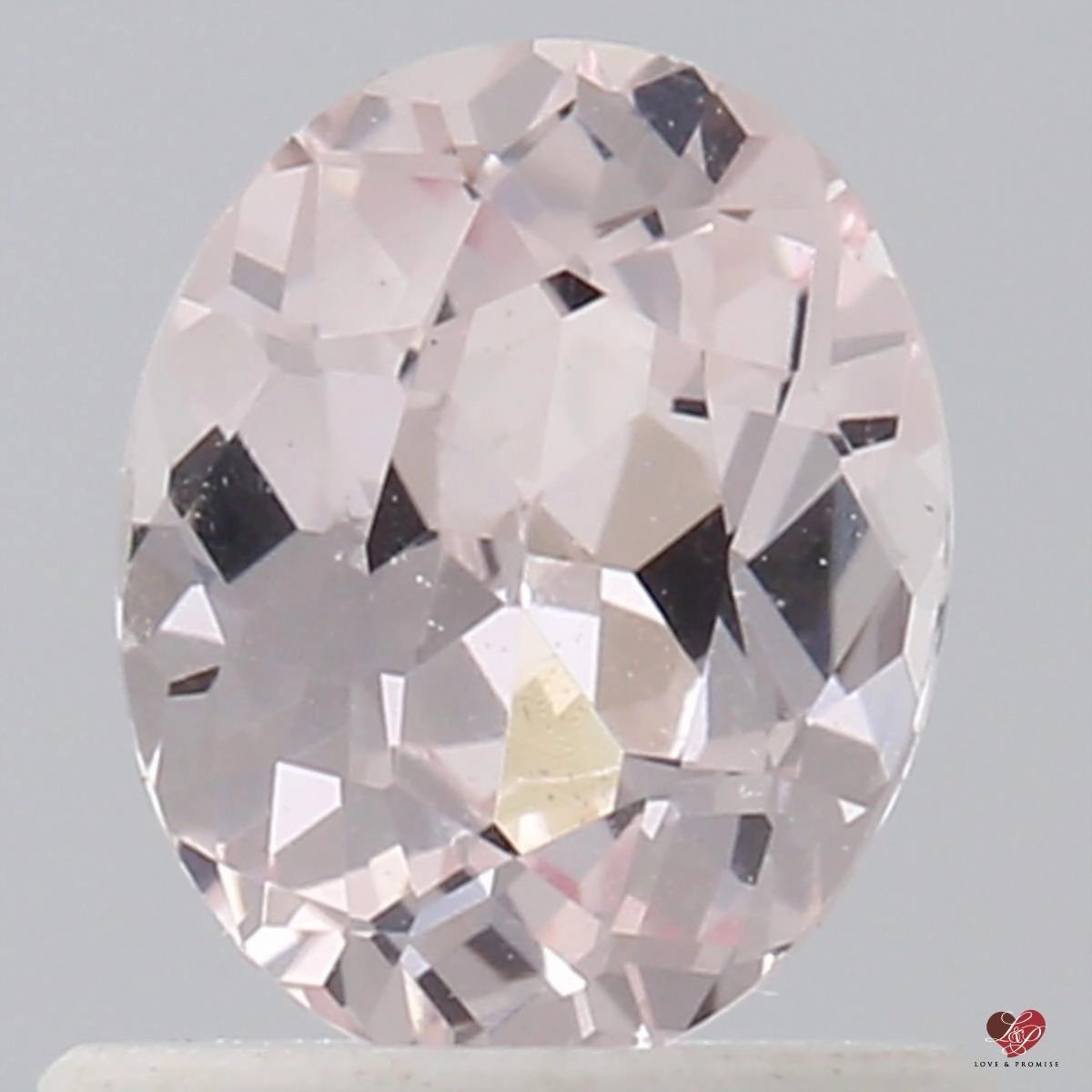 0.91cts Oval Icy Peachy Pink Champagne Sapphire